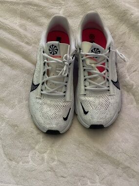 Nike White Flyknit Sneakers with Navy Swoosh and Pink Insoles